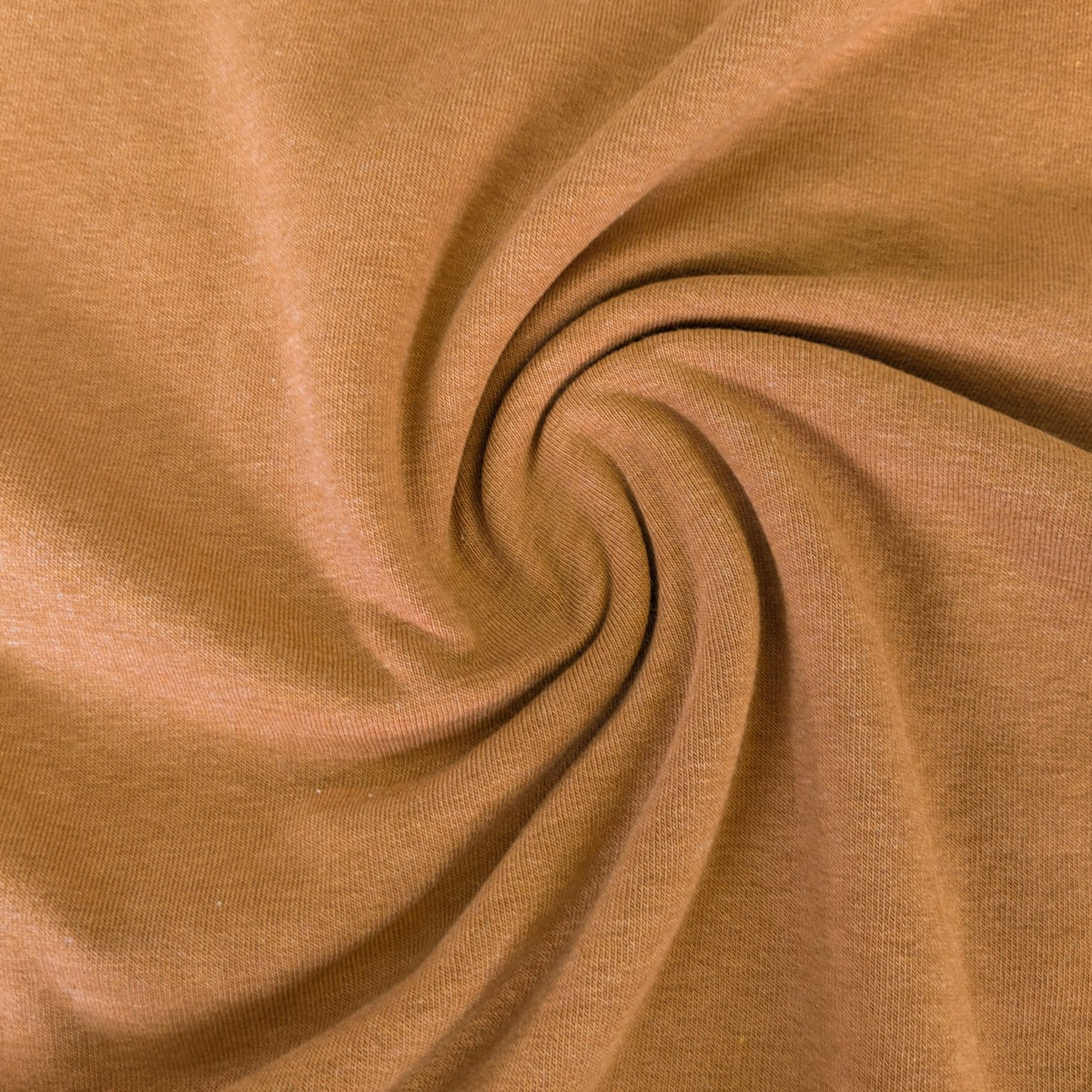 A swatch of ochre fleece backed sweatshirt fabric with a brushed texture, laid out flat.